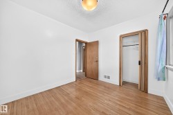 Bedroom with large Window and Hardwood Flooring - 