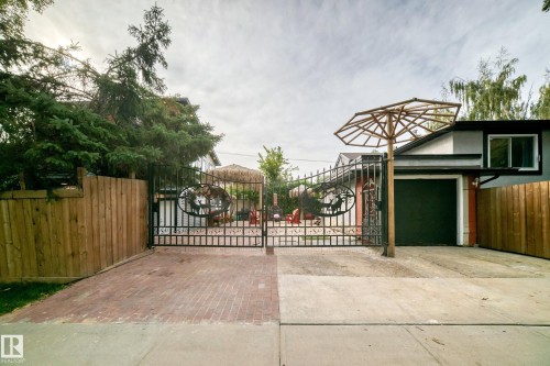 Wrought iron entry gates with custom detailing - 12045 64 Street Nw, Edmonton, AB 