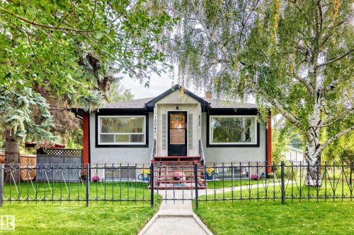 Exterior featuring a black wrought iron fence - 12045 64 Street Nw, Edmonton, AB 
