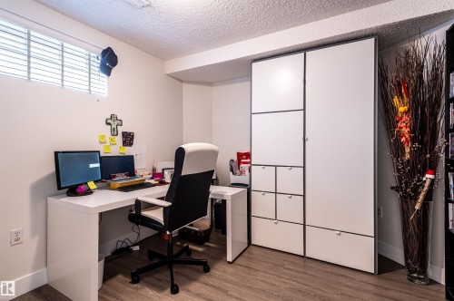Wood-finish flooring, white walls, and a small window with blinds - 38 Dubonnet Way, St. Albert, AB 