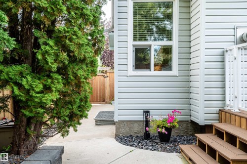 Light gray horizontal siding with white trim window - 38 Dubonnet Way, St. Albert, AB 