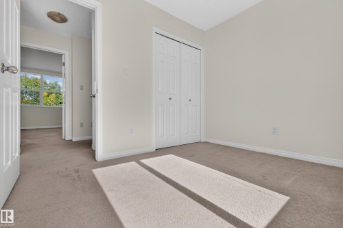 Neutral-toned carpeting throughout - 6933 21A Avenue Sw, Edmonton, AB 
