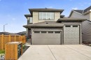 Contemporary exterior featuring stone accents and stucco siding - 22 Sydwyck Circle, Spruce Grove, AB 