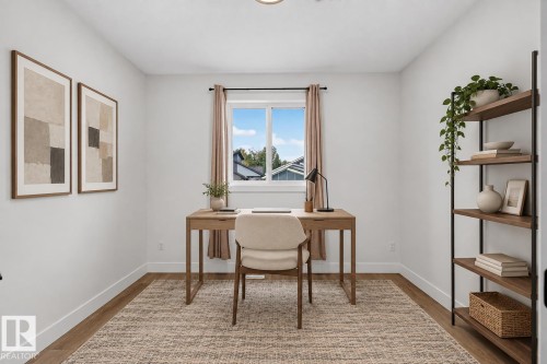 White walls, window with a black frame, wood-finish flooring, recessed lighting - 22 Sydwyck Circle, Spruce Grove, AB 