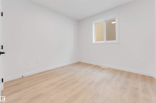 Light wood-finish flooring with white walls - 13 Trill Point(E), Spruce Grove, AB 