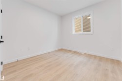Light wood-finish flooring with white walls - 