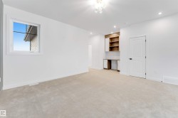 Recessed lighting, built-in desk with shelving, built-in cabinetry, neutral wall paint, and plush carpeting - 
