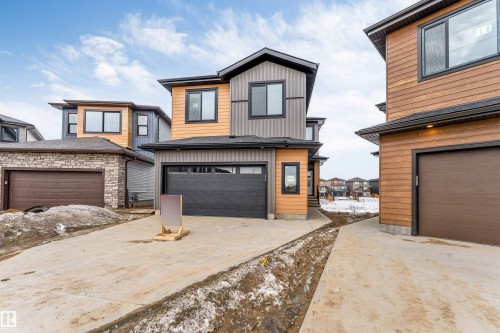 Contemporary exterior with multi-toned siding and dark trim - 13 Trill Point(E), Spruce Grove, AB 
