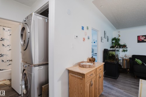 Stacked front-load laundry appliances - 11134 11138 116 Street Nw, Edmonton, AB 