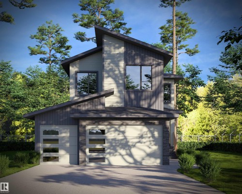 Modern exterior with mixed material siding, stone accents, and an attached two-car garage - 17 Owl Ridge Close, Fort Saskatchewan, AB 