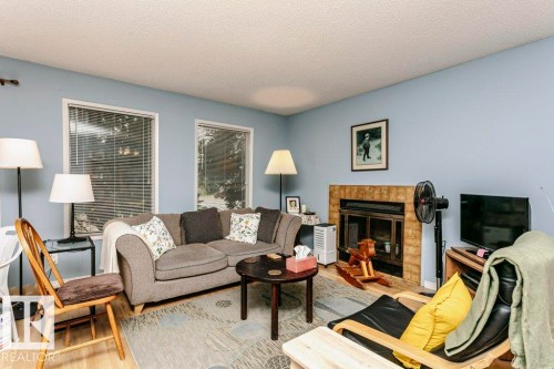 10968 35 Avenue Nw, Edmonton, AB - Indoor Photo Showing Living Room With Fireplace