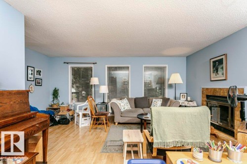 10968 35 Avenue Nw, Edmonton, AB - Indoor Photo Showing Living Room With Fireplace