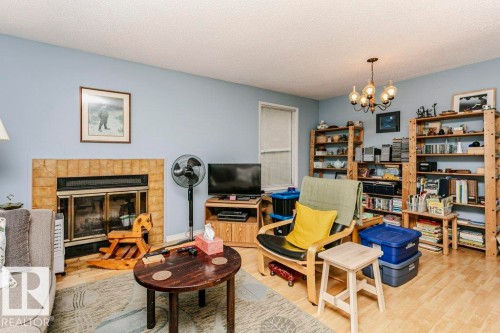 10968 35 Avenue Nw, Edmonton, AB - Indoor Photo Showing Living Room With Fireplace