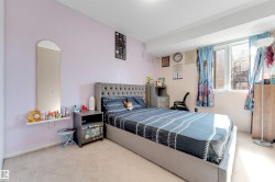 Wall-to-wall carpeting and a large window providing ample illumination - 