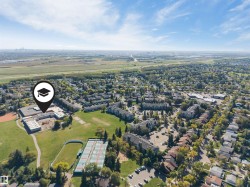 Aerial perspective showcasing a developed suburban area with extensive tree coverage - 