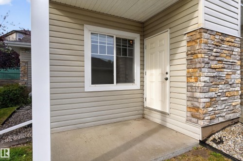 Exterior with horizontal siding and stone veneer accents - #156 460 Cranberry Wy, Sherwood Park, AB 