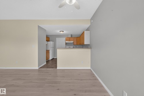 Wood-finish flooring throughout, with a ceiling fan overhead - #156 460 Cranberry Wy, Sherwood Park, AB 
