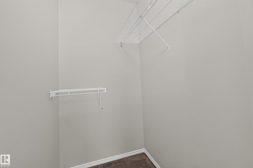 White wire shelving and hanging rods - #156 460 Cranberry Wy, Sherwood Park, AB 