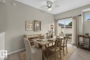 Angled ceiling with a ceiling fan, wood-finish flooring, and a sliding glass door - #156 460 Cranberry Wy, Sherwood Park, AB 