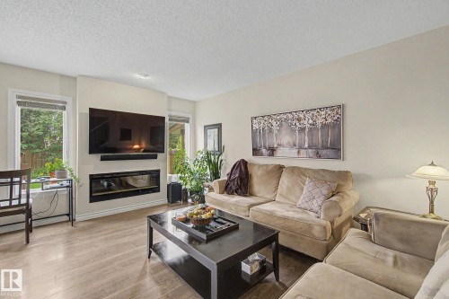 7 Peter Street, Spruce Grove, AB - Indoor Photo Showing Living Room With Fireplace