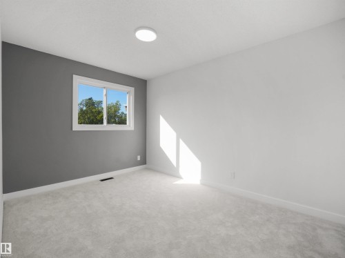 Window with white trim, light-colored carpeting, recessed ceiling light, and a two-toned wall finish - 12C Twin Terrace Nw, Edmonton, AB 