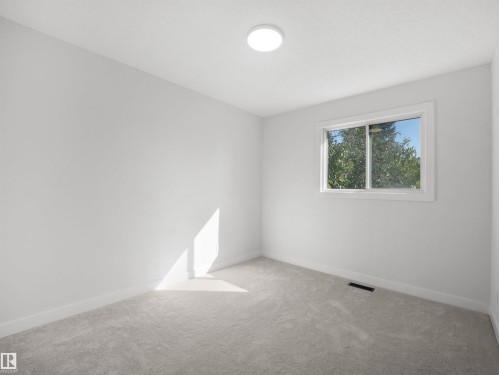 Light gray wall-to-wall carpeting with white baseboards and trim - 12C Twin Terrace Nw, Edmonton, AB 