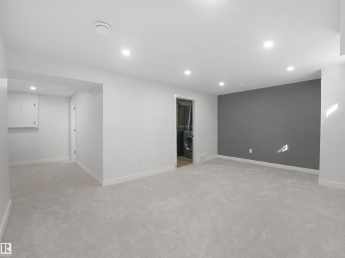 Recessed ceiling lighting, light gray carpeting, white walls, and a gray accent wall - 12C Twin Terrace Nw, Edmonton, AB 