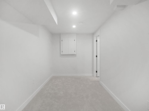 Recessed lighting, wall-mounted cabinetry, soft gray carpeting, and white trim - 12C Twin Terrace Nw, Edmonton, AB 