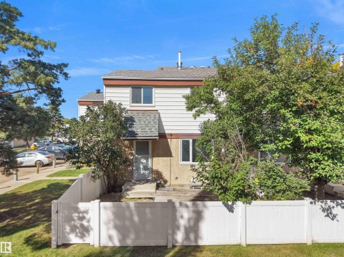 Two-story exterior with white siding and a brown trim - 12C Twin Terrace Nw, Edmonton, AB 