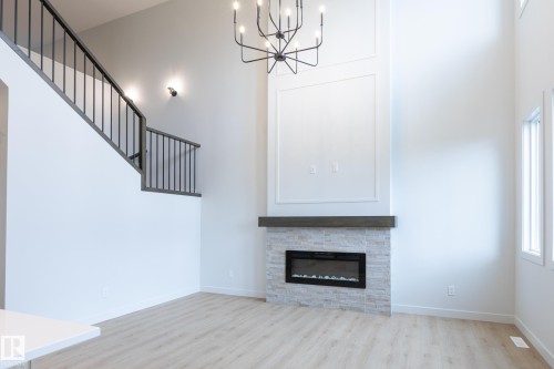 Double-height interior with wood-finish flooring - 4005 36 Street, Beaumont, AB 
