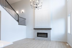 Double-height interior with wood-finish flooring - 