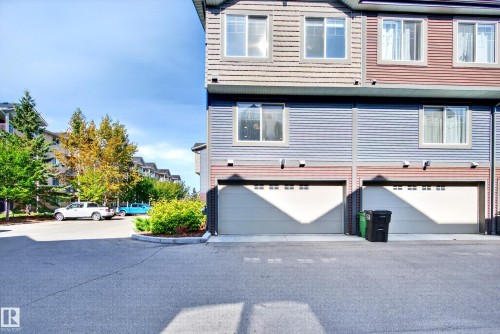 Multi-level exterior with horizontal siding and multiple windows - #44 3025 151 Av Nw, Edmonton, AB 