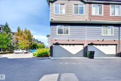 Multi-level exterior with horizontal siding and multiple windows - 