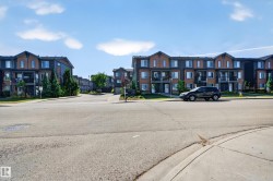 Multi-story residential buildings with brick and siding facades - 