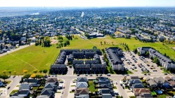 Aerial perspective showcasing a residential community with abundant green spaces - 