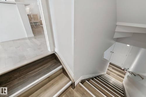 Wood-finish stairs with contrasting risers - 8535 Ellis Link Link Nw, Edmonton, AB 