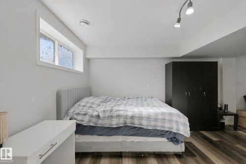 Recessed window, wood-finish flooring, white walls, built-in lighting fixture, track lighting - 8535 Ellis Link Link Nw, Edmonton, AB 