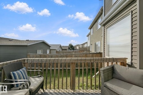 Hardwood deck with a wooden privacy fence and exterior siding - 8535 Ellis Link Link Nw, Edmonton, AB 