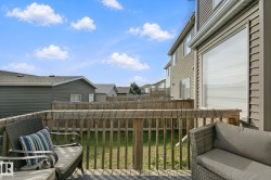 Hardwood deck with a wooden privacy fence and exterior siding - 