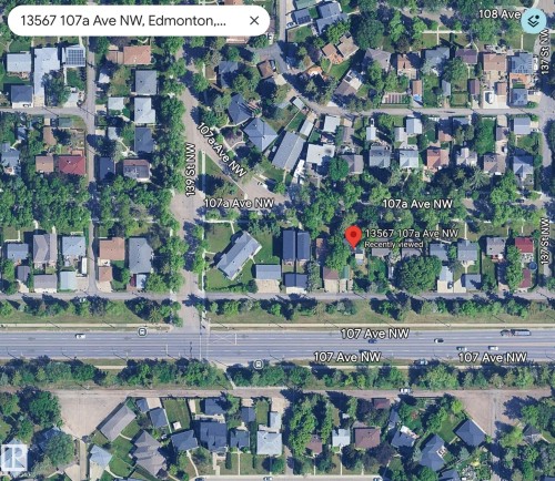 Satellite Imagery. Showing the property at 13567 107a Ave NW, Edmonton, within its surrounding geographical context - 13567 107A Avenue Nw, Edmonton, AB 