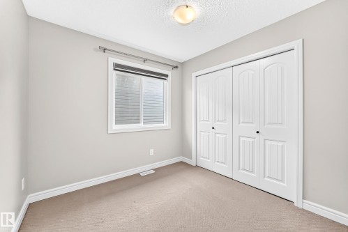 Neutral-toned walls complement the light-colored carpet flooring - Edmonton, AB 