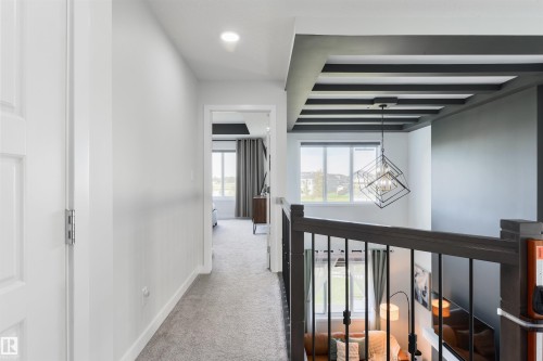 Carpeted hallway with recessed lighting - 1032 Berg Place, Leduc, AB 