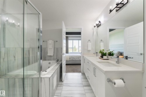 Dual vanity with white cabinetry and integrated sinks - 1032 Berg Place, Leduc, AB 