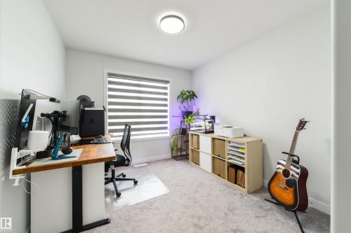 Recessed ceiling light, neutral wall colors, and light-toned carpeting - 1032 Berg Place, Leduc, AB 