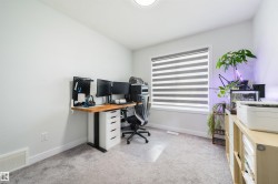 Recessed lighting, light gray wall paint, and gray carpeting - 
