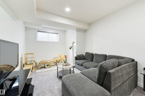 Recessed lighting illuminates this bright room with a single window - 1032 Berg Place, Leduc, AB 