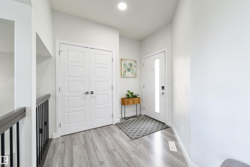 Wood-finish flooring with a light grey tone - 1032 Berg Place, Leduc, AB 