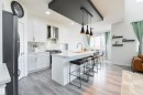 White shaker cabinetry with a marble-look backsplash and stainless steel appliances - 1032 Berg Place, Leduc, AB 