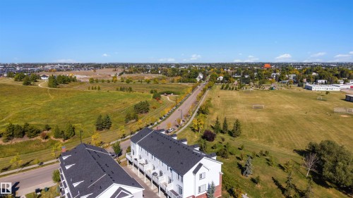 Townhome-style architecture with dark shingle roofs - #1 1636 Kerr Rd Nw, Edmonton, AB 