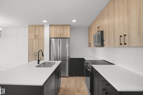 #21 1430 Aster Wy Nw, Edmonton, AB - Indoor Photo Showing Kitchen With Double Sink With Upgraded Kitchen